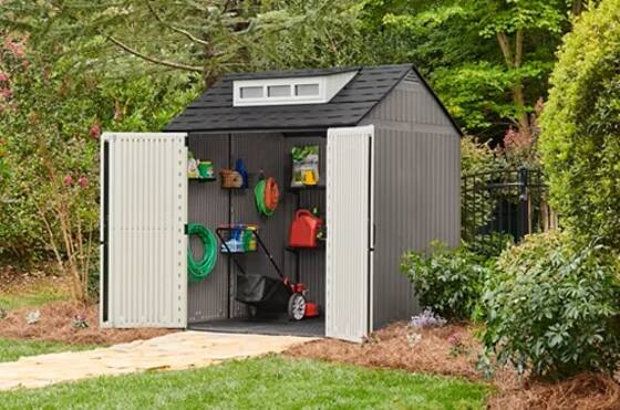 Wide double-door opening on the Rubbermaid 7x7 gray resin shed for easy access.