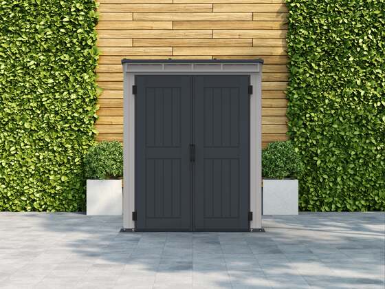 Yardmate shed assembles against the wall