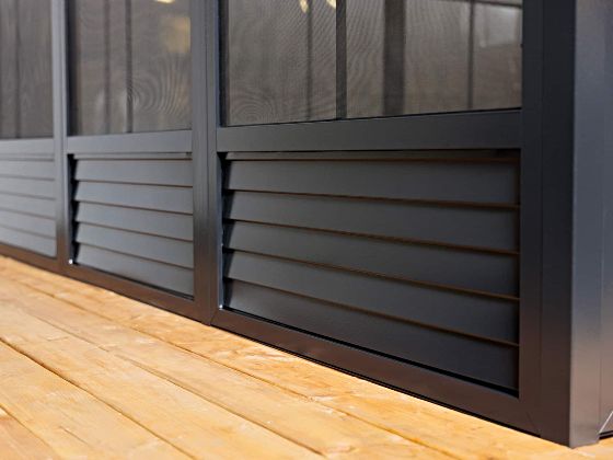The louvered base panels are designed to enhance durability, subtly improve airflow, and prevent water buildup.