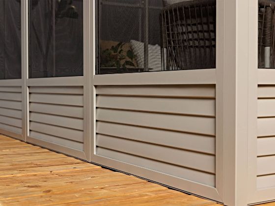 The louvered base panels are designed to enhance durability, subtly improve airflow, and prevent water buildup.
