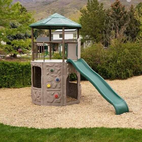 Featuring climbing walls, slide, storefronts & steering wheel for outdoor fun.