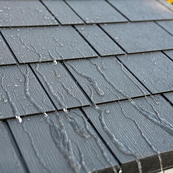 High-Pitched, Heavy-Duty Roof - Steep slope ensures quick rain and snow runoff, while steel trusses add strength. UV-protected with a simulated shingle finish.
